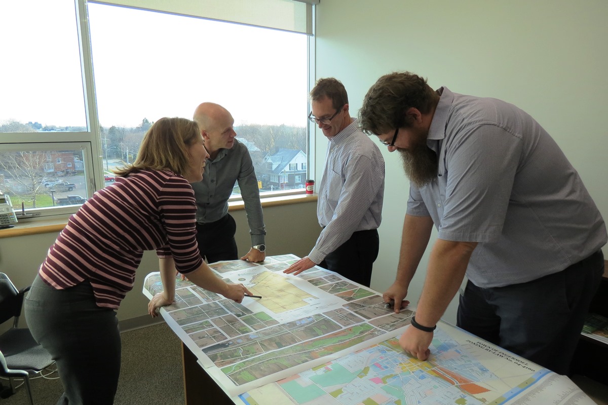 GIS team looking at maps