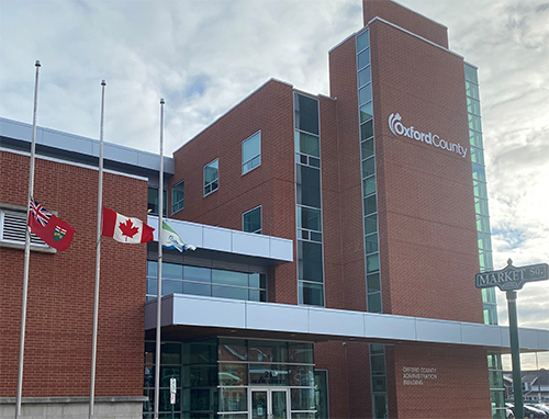 Flags at half mast in front of the Oxford County Administration Building